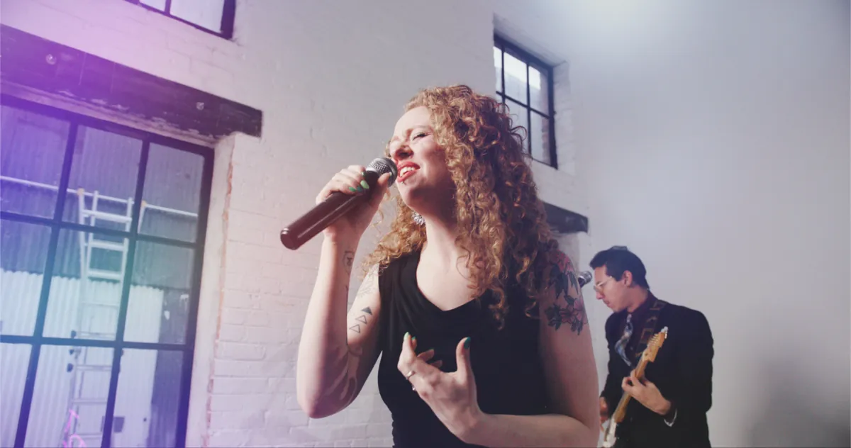 Tiny Pockets vocalist with purple lighting